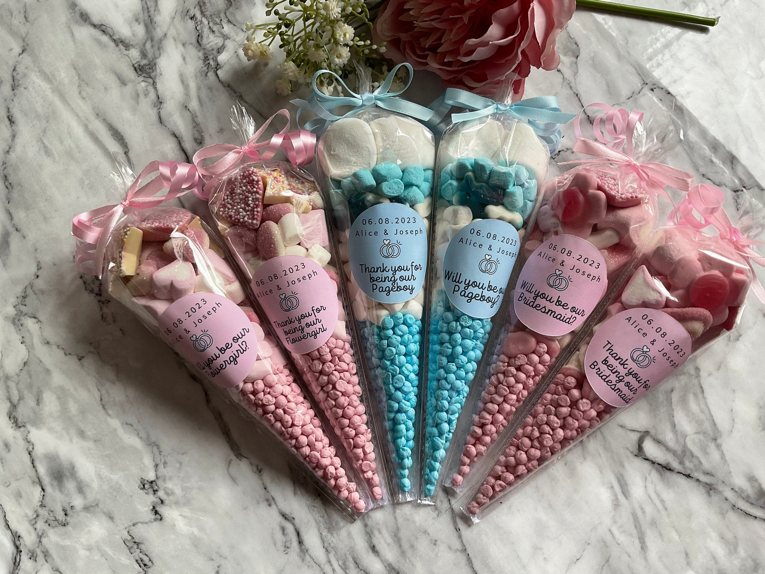 Pink and Blue sweet cones reading Thank you for being our flower girl/pageboy/bridesmaid