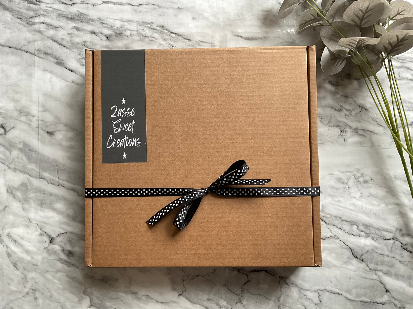 Liquorice Sweet Box wrapped with a black ribbon